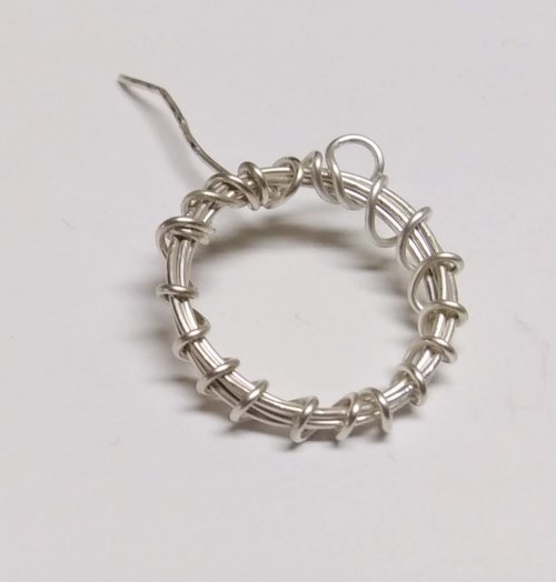 Judy Larson's Smashing Drop Earrings - , Contemporary Wire Jewelry, Oxidizing Wire, Oxidizing, Antiquing Wire, Antiquing, Continue wrapping around the core wire coil.